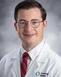 Timothy L Helland