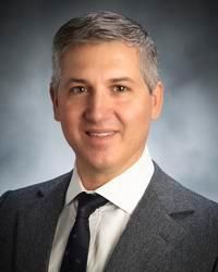 George M Comas