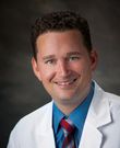 Curtis Malcom, MD